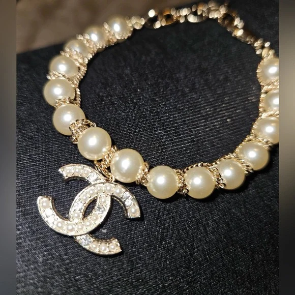 Gold-Tone Pearl Bracelet with Crystallized Logo Pendant - Picture 3 of 7